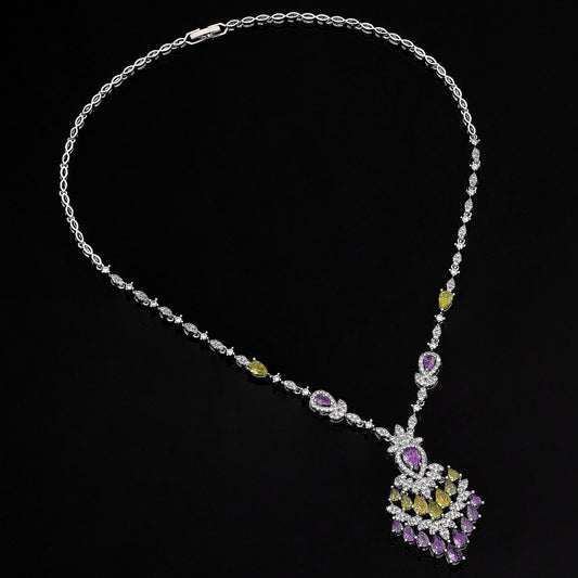 Necklace with a peacock feather pendant on a black background