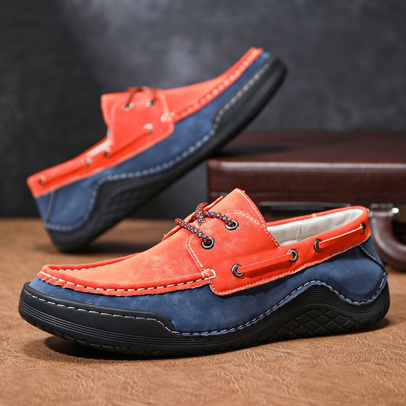 Red and blue loafers on a wooden surface with a dark background