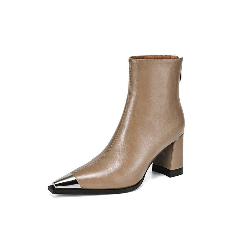A taupe leather ankle boot with a pointed toe accented by a polished silver metal cap and a chunky block heel, shown against a plain white background.