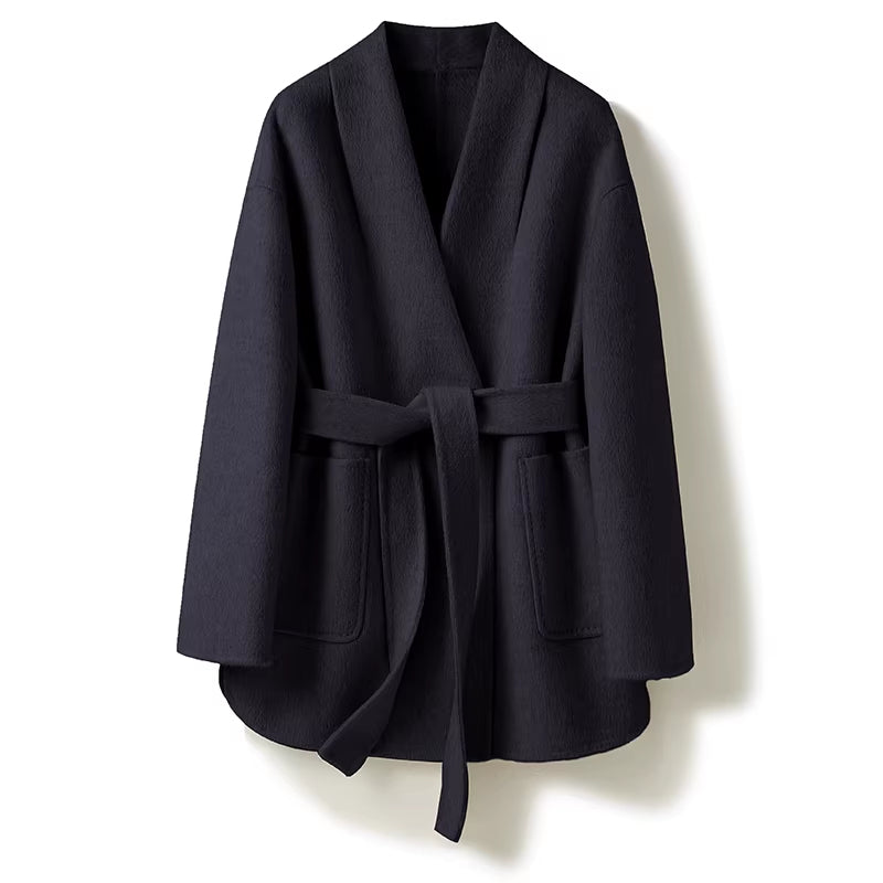 Black coat with a belt on a white background