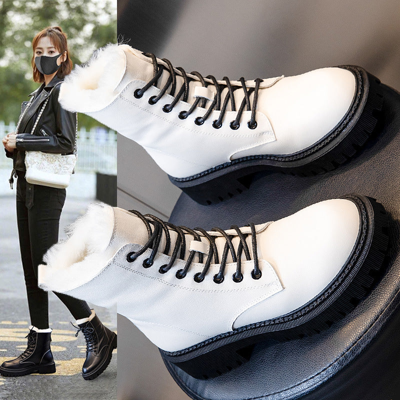 White high-top sneakers with black laces on a gray background, with a person wearing similar shoes in the corner.