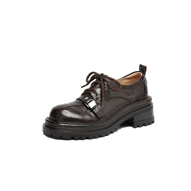 Brown leather shoe with a thick sole on a white background