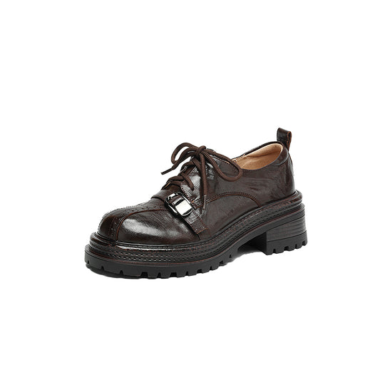 Brown leather shoe with a thick sole on a white background