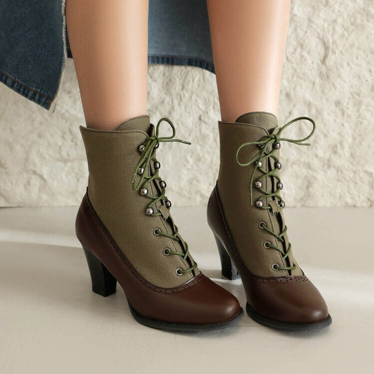 Green and brown lace-up boots on a neutral background