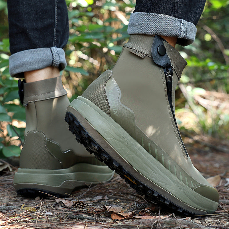 Green rubber boots worn outdoors on a natural background