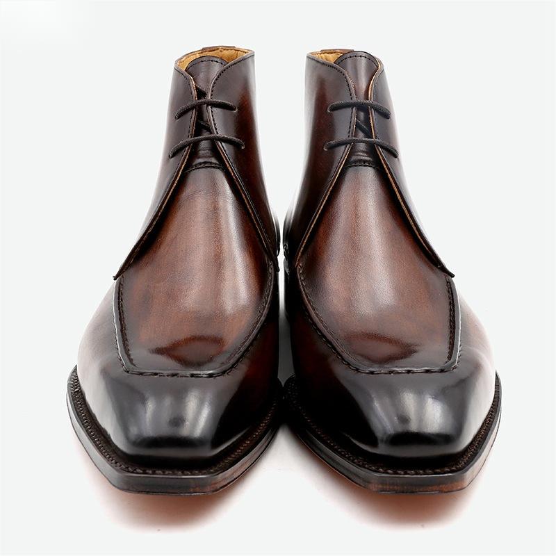 Pair of brown leather dress shoes on a white background