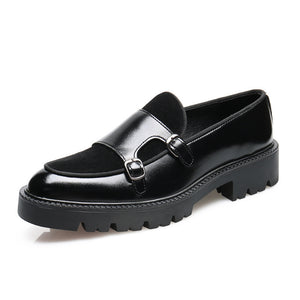 Black leather loafer with a chunky sole on a white background