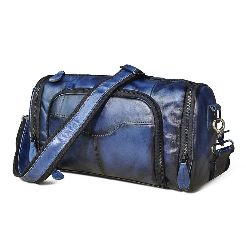 Blue duffel bag with black accents on a white background