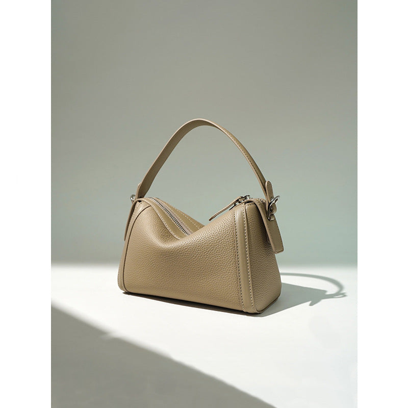 Beige handbag on a light background
