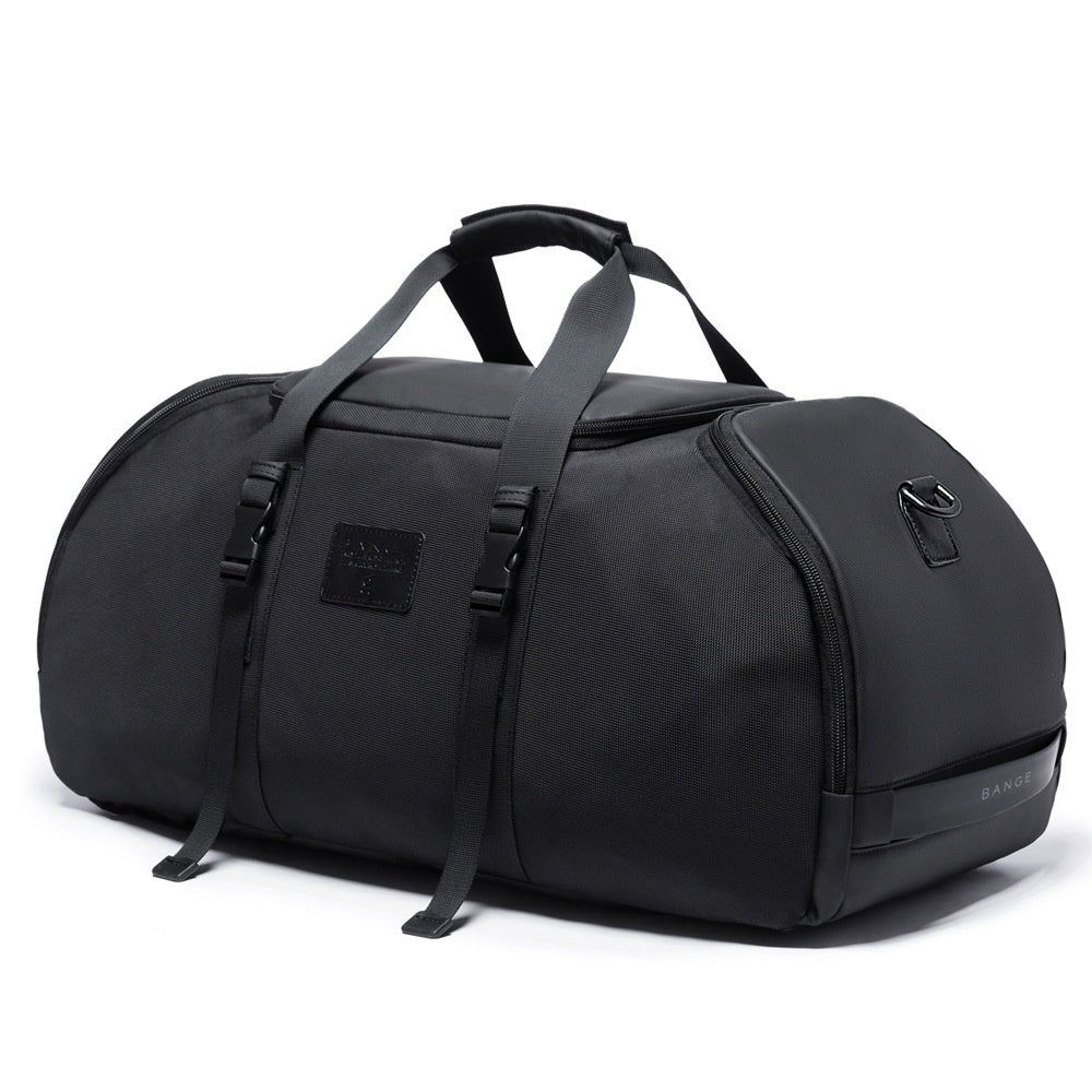 Black duffel bag with straps on a white background