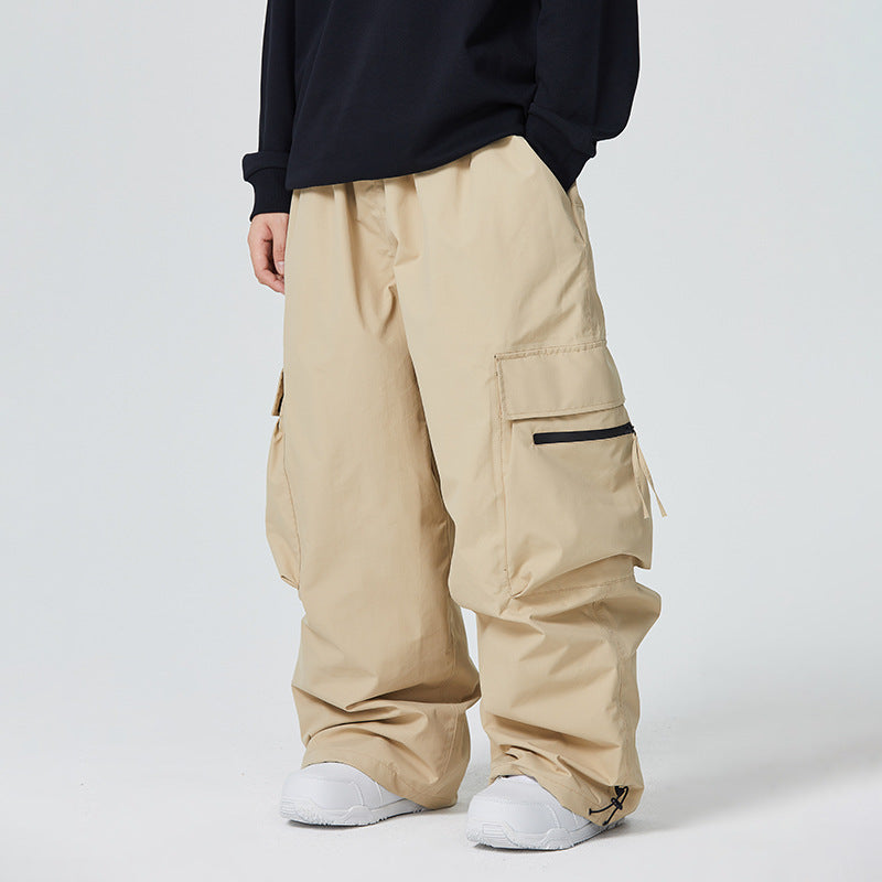 Person wearing beige cargo pants on a white background