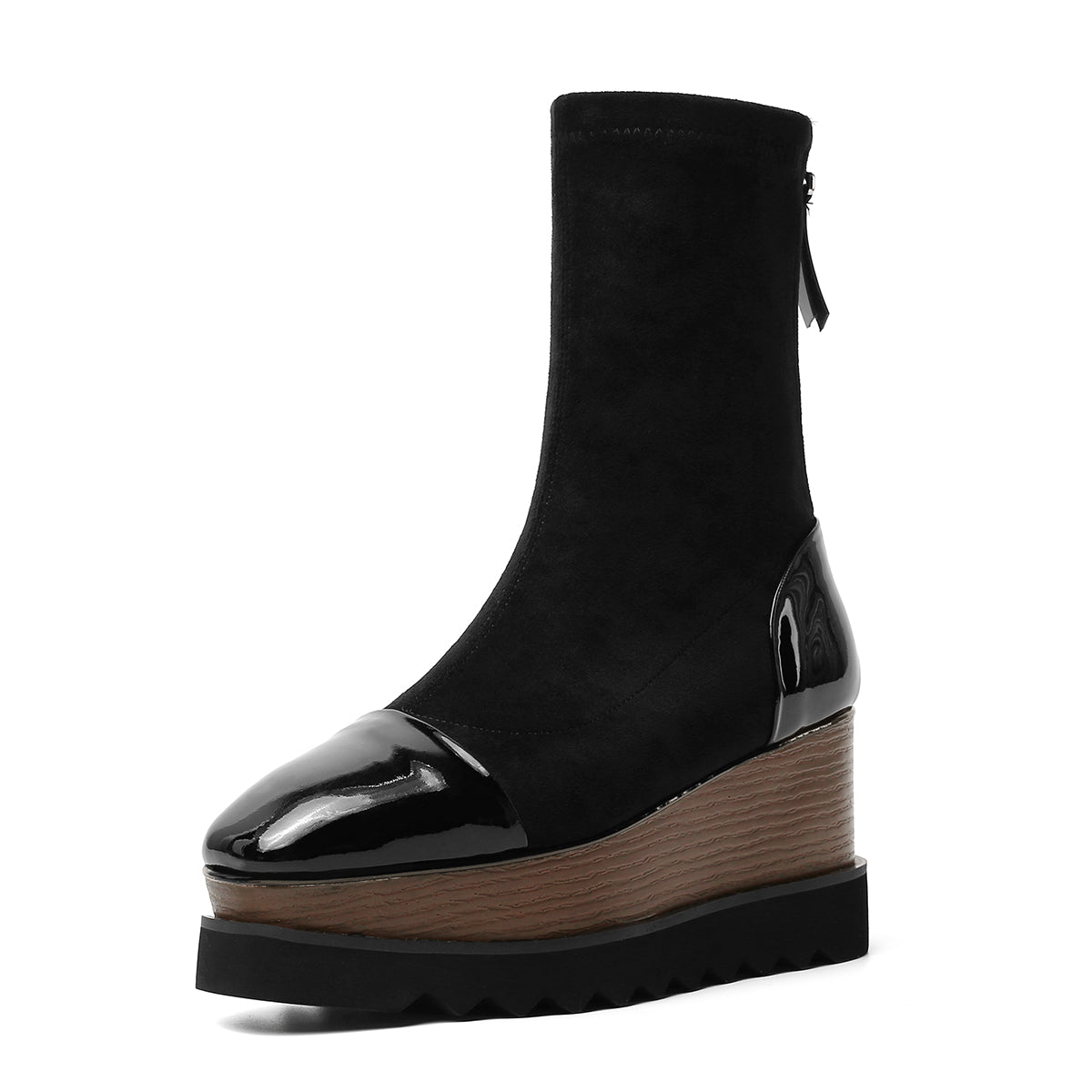 Black platform ankle boot with brown sole on a white background