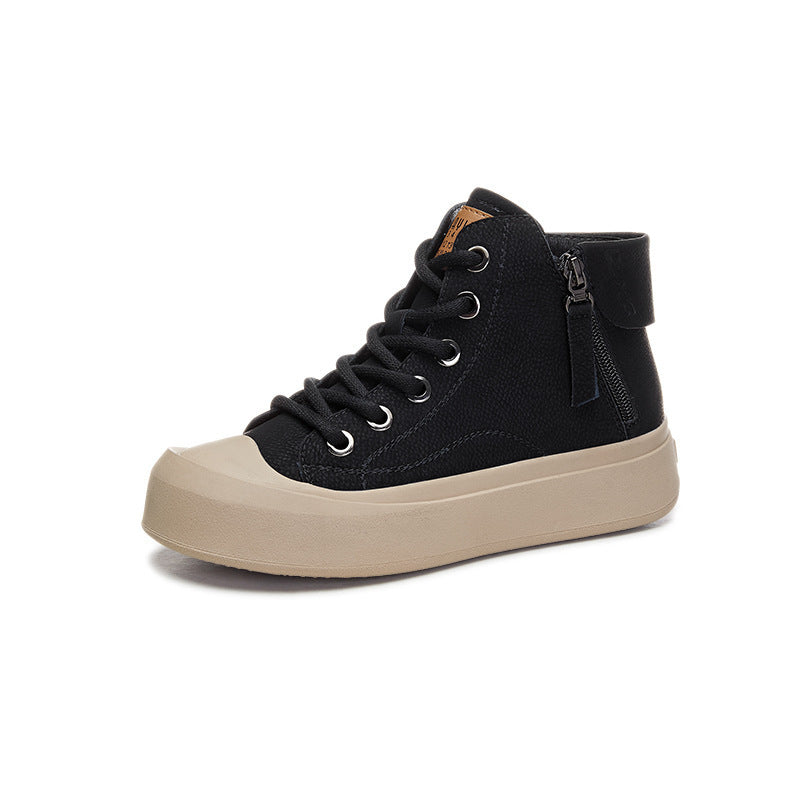 Black high-top sneaker with beige sole on a white background