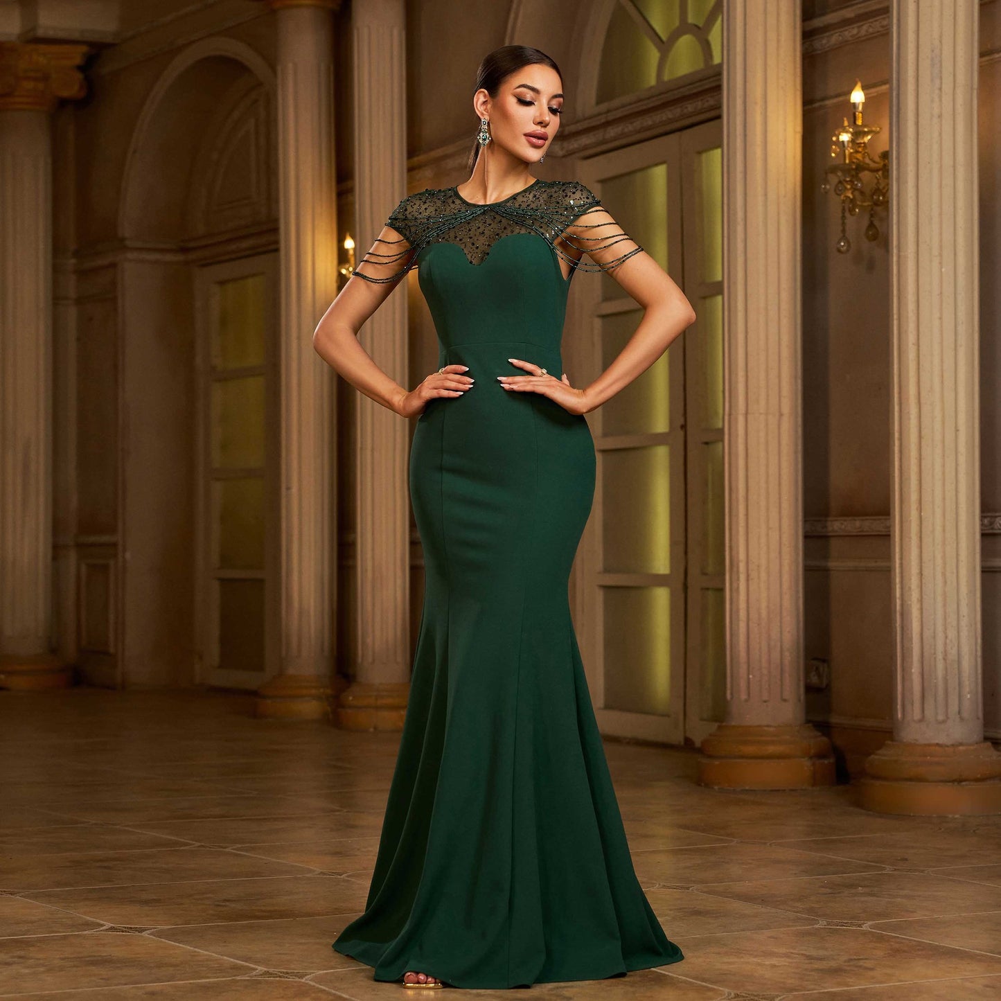 Woman in a green evening gown with black lace details in an elegant interior setting. by millivan