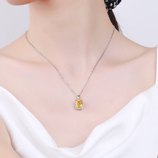 Necklace with a yellow pendant on a mannequin