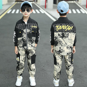 Child wearing a black and white camouflage outfit with 'DAMN' text, standing on a road.