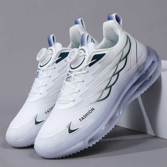 White sneakers with green accents on a gray background