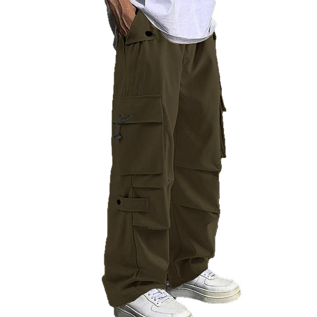 Green cargo pants worn by a person on a white background
