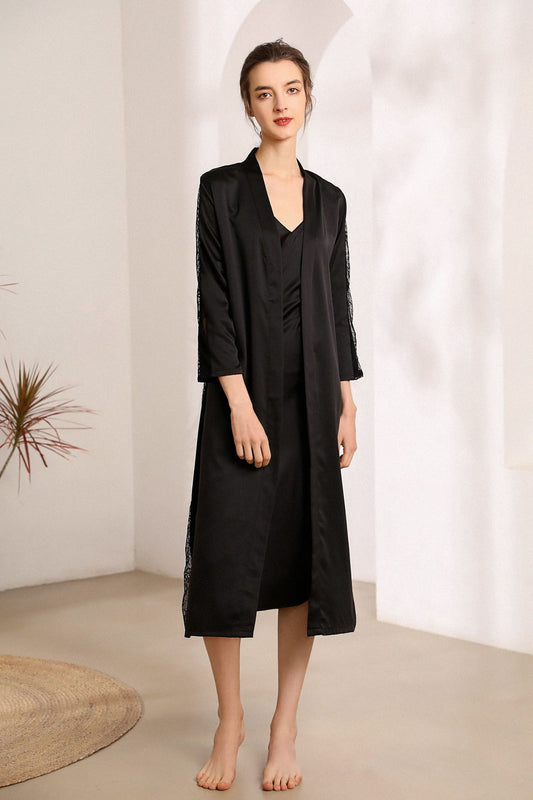 Woman wearing a black dress with a white background