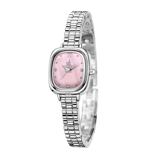Silver watch with a pink face on a white background