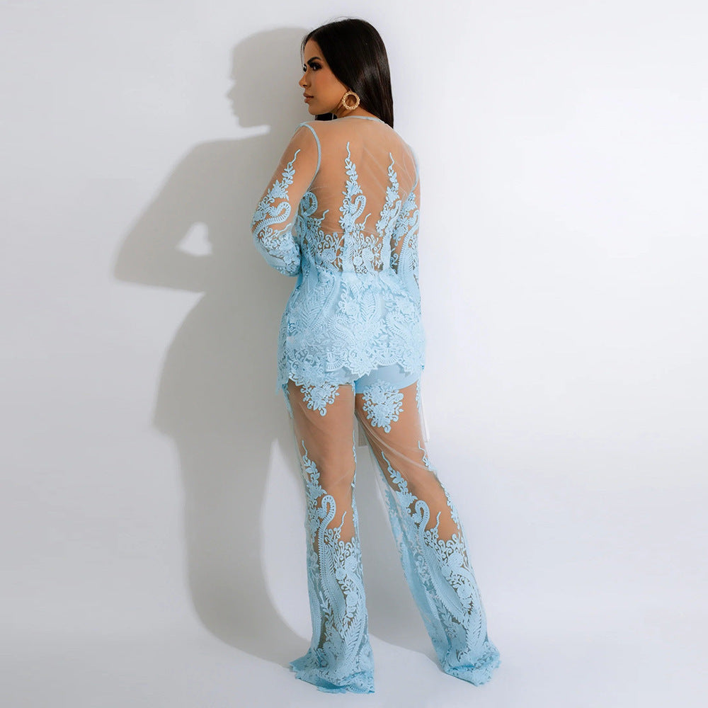 Woman wearing a light blue lace outfit against a white background