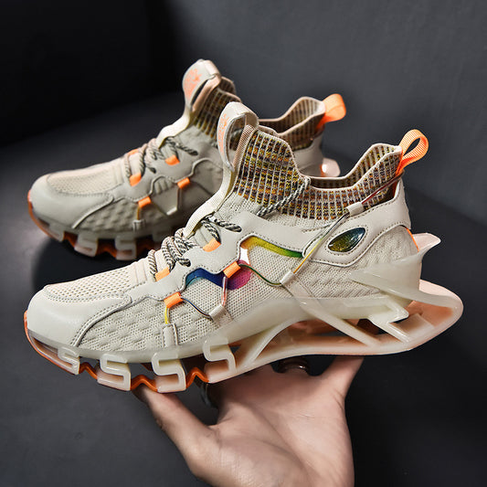 Beige sneakers with orange accents held by a hand against a dark background