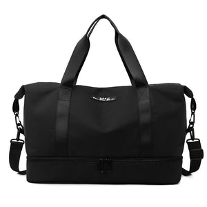 Black duffel bag with shoulder straps on a white background