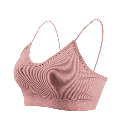 Pink ribbed sports bra on a white background