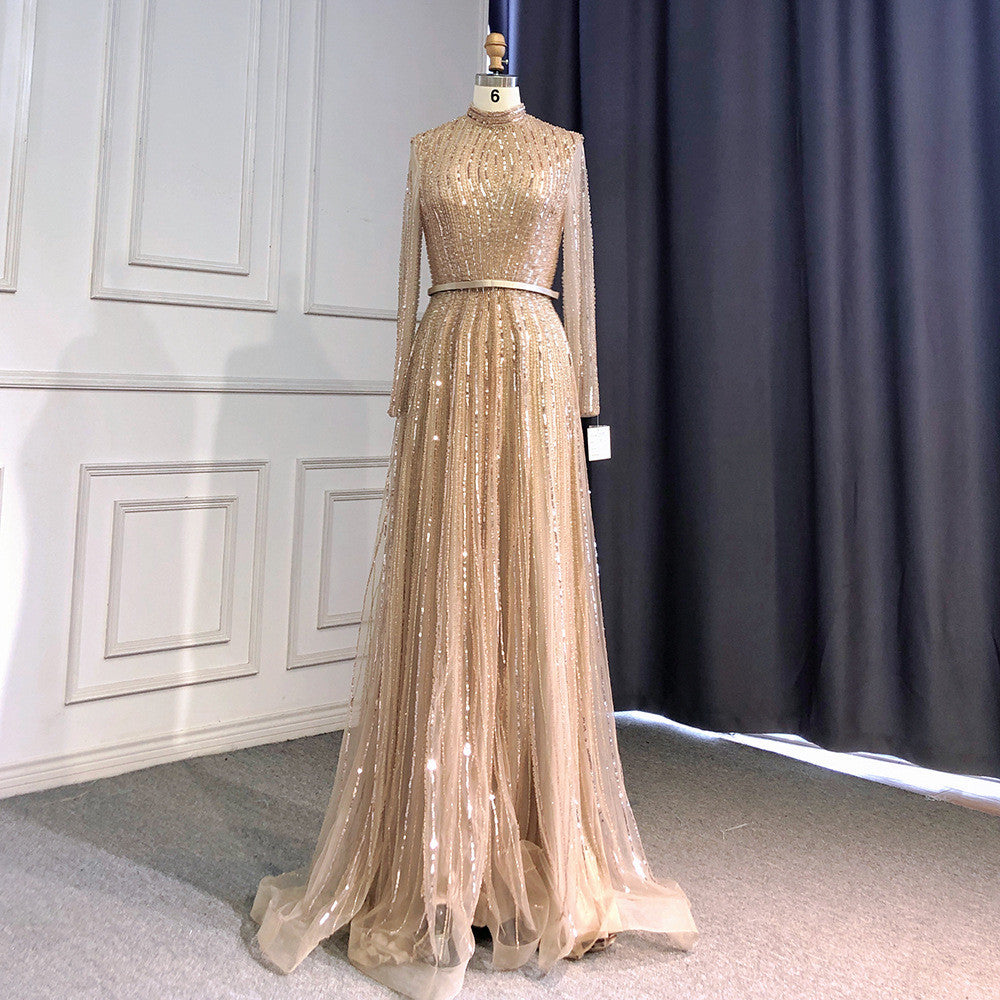 Gold evening gown on a mannequin against a neutral background