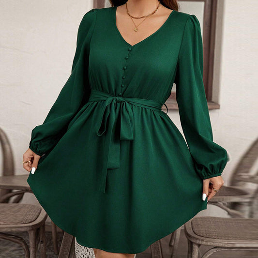 Green dress with long sleeves and a belt worn by a person indoors.
