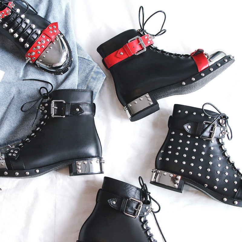 Black boots with red and silver accents on a light background