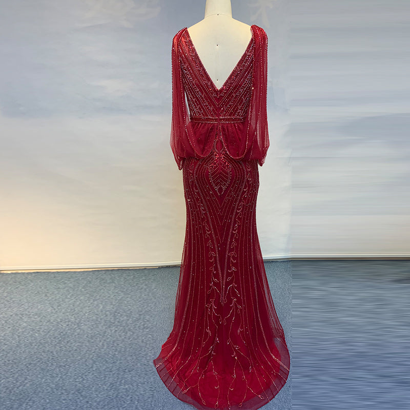 Red beaded evening gown on a mannequin against a neutral background