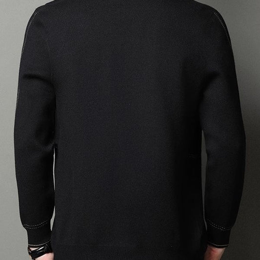 Black long-sleeve shirt on a gray background