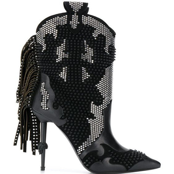 Black studded high-heeled boots with fringe on a white background