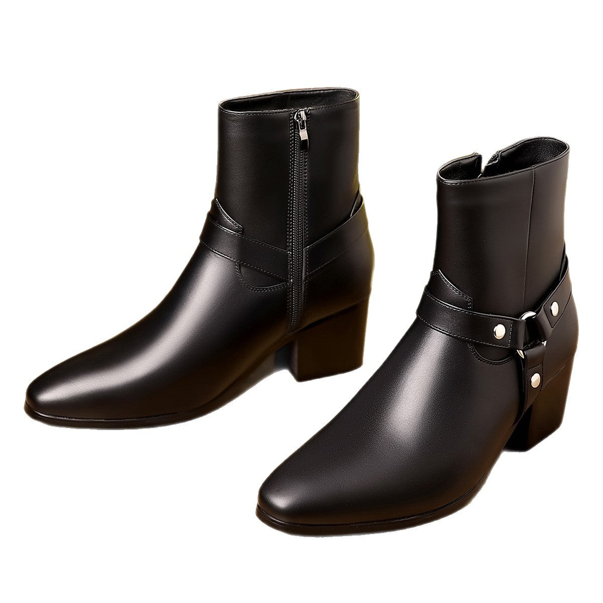 Pair of black leather boots with buckles on a white background