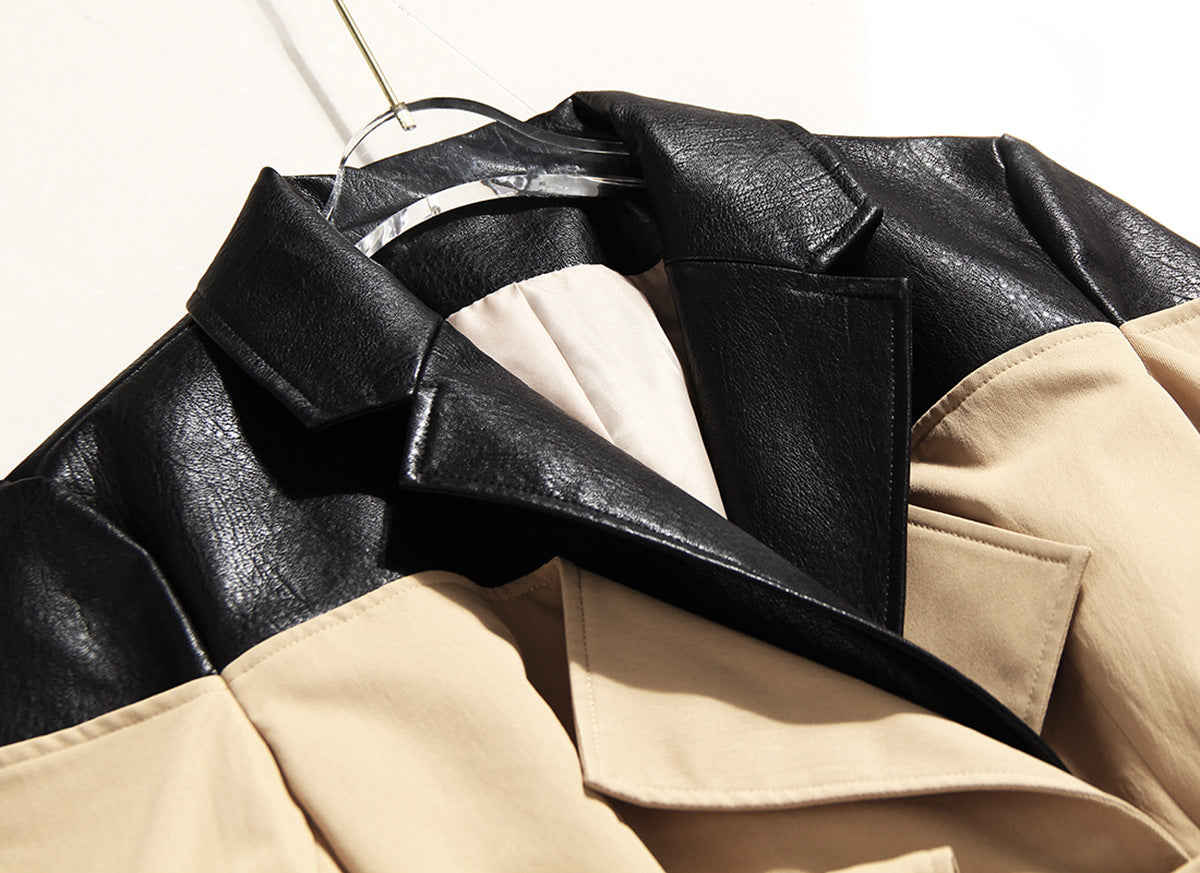 Black and beige leather jacket on a hanger against a white background by millivan