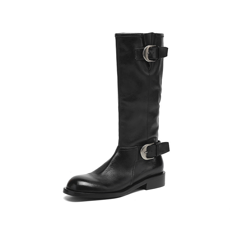 Black knee-high boot with buckles on a white background