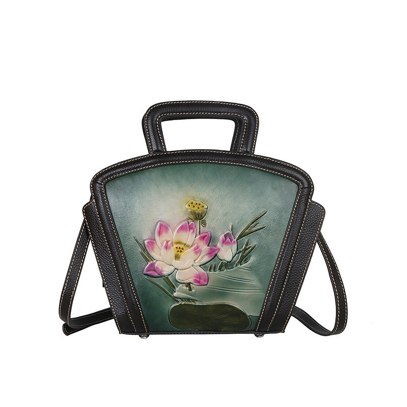 Handbag with floral design on a white background