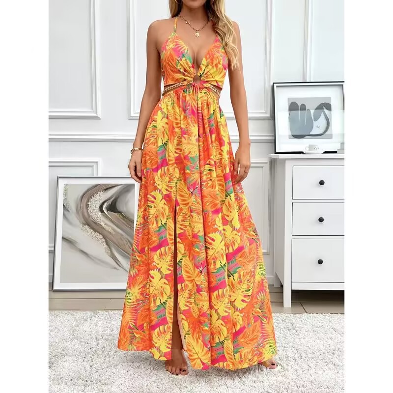 Woman wearing a colorful floral dress in a room with white walls and furniture.