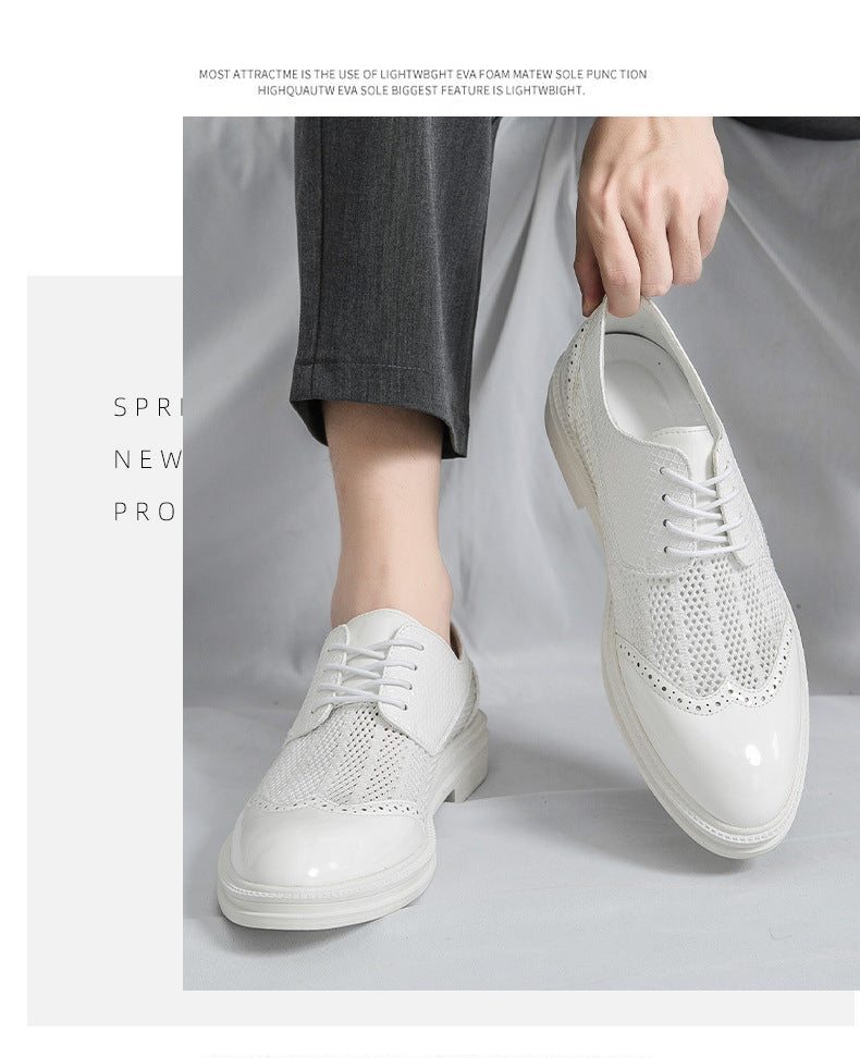 White sneakers worn with gray pants on a light gray background