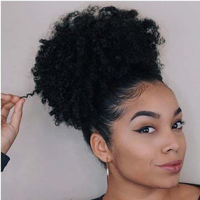 Woman with styled hair against a neutral background