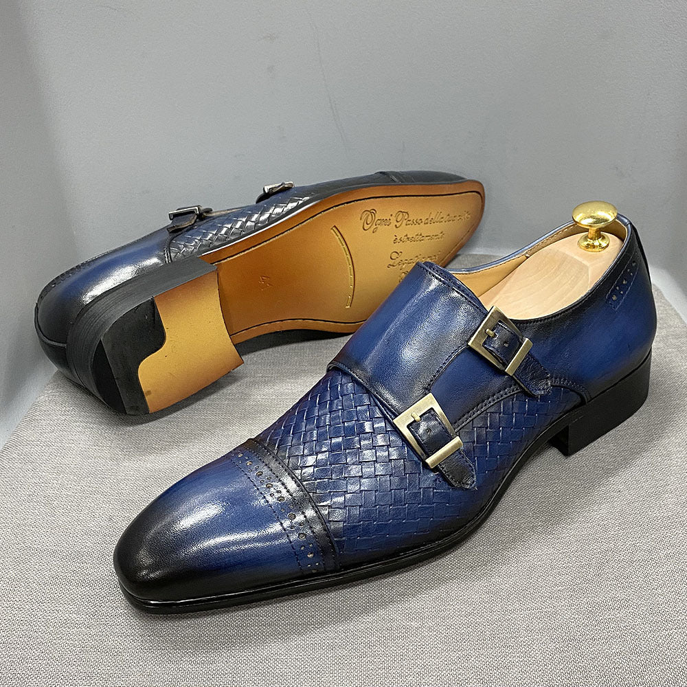 Blue woven dress shoes with gold buckles on a gray background