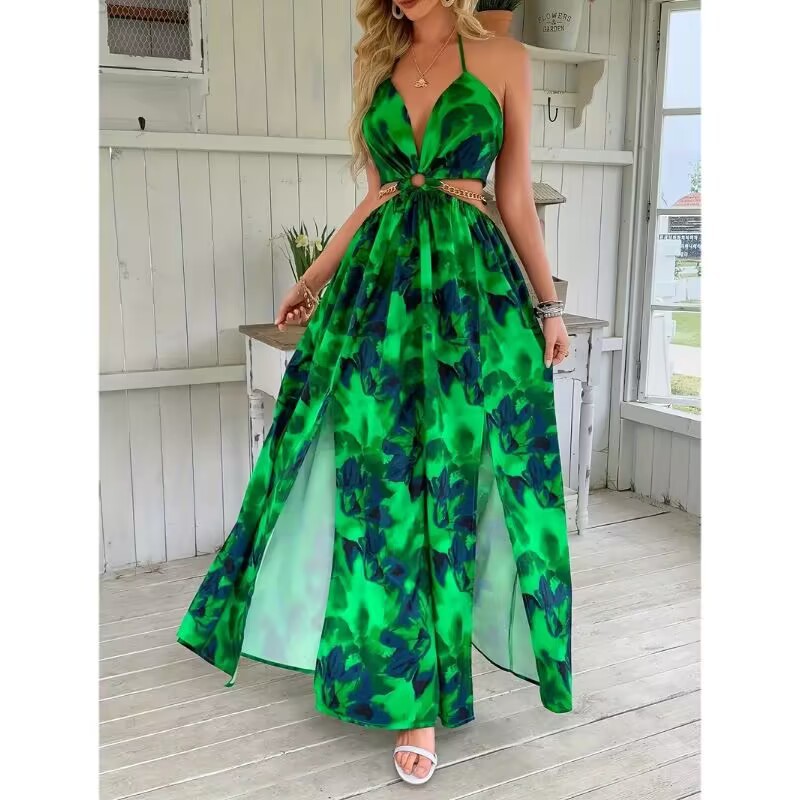 Woman wearing a green floral dress in a coastal setting