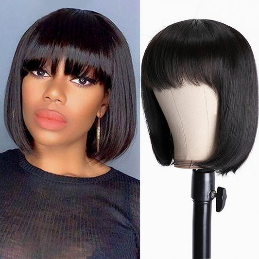 Black bob wig on a mannequin head and a woman wearing it.