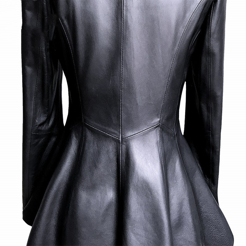 Black leather dress with a fitted bodice and flared skirt on a white background
