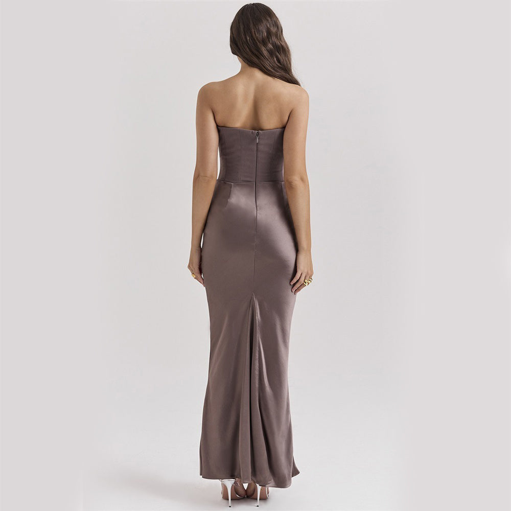 Woman wearing a strapless brown evening gown on a white background
