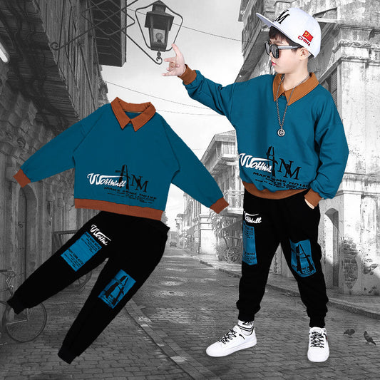 Person wearing a blue and brown outfit with matching jacket and pants on a street background