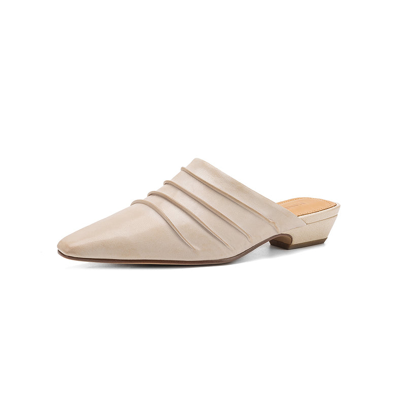 Beige mule shoe on a white background
