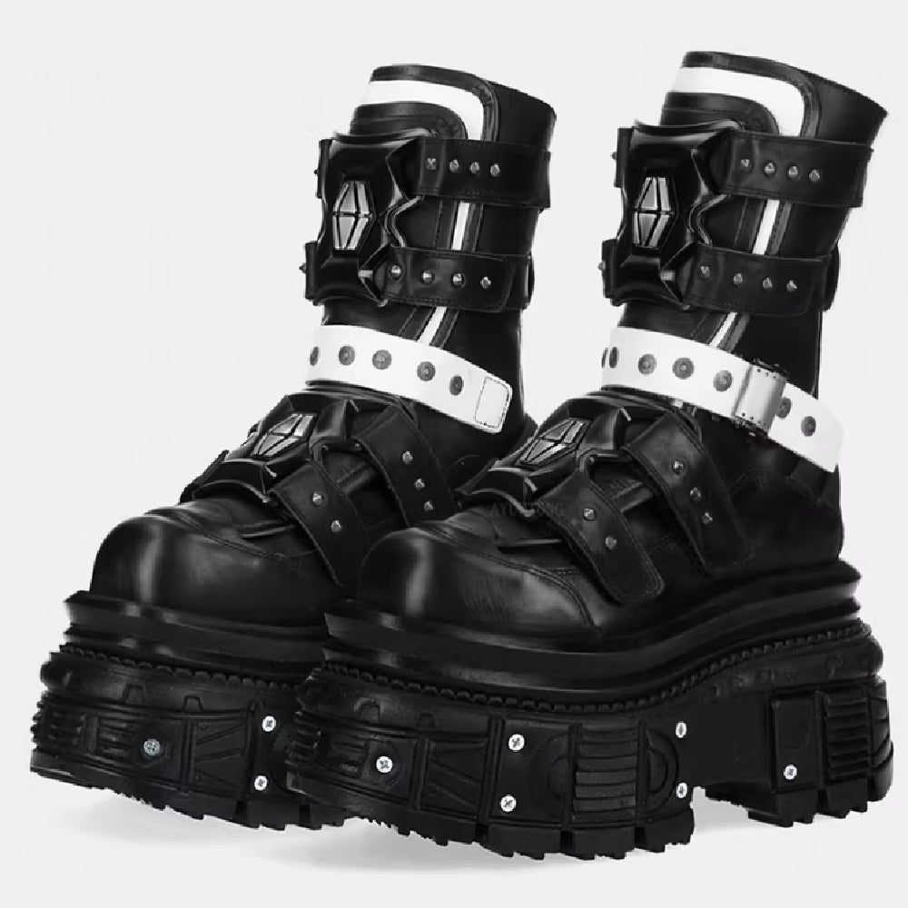 Black platform boots with metal accents on a white background