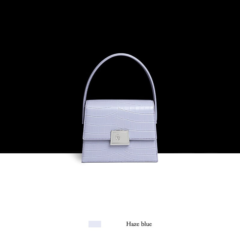 Haze blue handbag with a black and white background